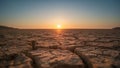 Cracked Earth at Sunset. A Dry Lakebed Landscape, A Reminder of Environmental Changes. Royalty Free Stock Photo