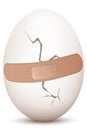 Cracked egg with bandage