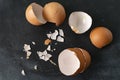 cracked egg shell isolated on dark background, ingredients for cookings Royalty Free Stock Photo