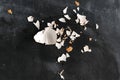 cracked egg shell isolated on dark background, ingredients for cookings Royalty Free Stock Photo