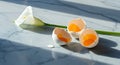 Cracked eggshells and calla lily on marble surface Royalty Free Stock Photo
