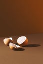 Cracked empty egg shells on brown background