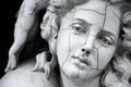 Cracked face of female Greek sculpture Royalty Free Stock Photo