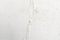 Cracked flaking white paint on the wall texture background. Royalty Free Stock Photo