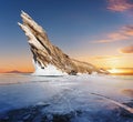 Cracked frozen lake with mountain on frozen lake Baikal in winter sunrise in Siberia, Russia Royalty Free Stock Photo