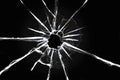 Cracked glass on a black background. Broken window. Bullet hole, abstraction for design Royalty Free Stock Photo