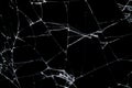 Cracked glass isolated on a black background.