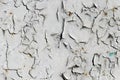 Cracked gray paint on an old metallic surface, rusted gray painted metal wall, sheet of rusty metal with cracked and flaky paint Royalty Free Stock Photo