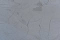 Cracked gray stucco background. Texture. Royalty Free Stock Photo