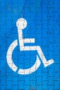 Cracked handicap sign on parking lot Royalty Free Stock Photo