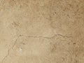 Cracked hard Plastered brown unpainted wall surface Royalty Free Stock Photo