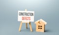 Cracked house and construction defects sign. Correction of damage and elimination of causes that violate the integrity of the Royalty Free Stock Photo