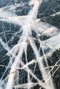 Cracked ice on a frozen lake, view from the top. Mouse background. Royalty Free Stock Photo