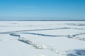 Cracked lake ice on a clear sunny very cold day. Royalty Free Stock Photo