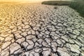 Cracked land, silt at low tide at sea on a sunny day