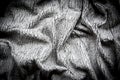 Cracked leather close-up fabric wrinkled gray background