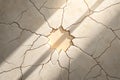 Cracked Marble Surface with Sunlit Hole and Shadow Royalty Free Stock Photo