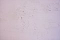 Cracked new paint on a white wall, background of fresh paint close-up Royalty Free Stock Photo