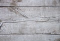 Cracked old wooden background, shabby painted wood texture, light grey rugged board, natural old rustic floor element close up top Royalty Free Stock Photo