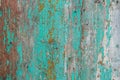 Cracked old wooden wall with textured paint, bright background c