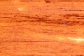 Cracked orange rust on metal weathered surface