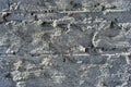 Cracked paint, plaster of soft gray on brick wall surface close up detail, grunge horizontal background Royalty Free Stock Photo