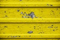 Cracked paint texture detail. Cracked flaking yellow paint, background texture