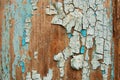 Cracked paint on a wooden wall. Wall from wooden planks with paint traces. Royalty Free Stock Photo