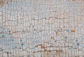 Cracked paint on a wooden wall. Wall from wooden planks with paint traces. Royalty Free Stock Photo