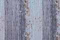 Cracked paint on a wooden wall. Wall from wooden planks with paint traces. Royalty Free Stock Photo