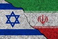 Cracked painted concrete walls between the Israel flag and Iran. Concept of conflict Royalty Free Stock Photo