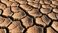 Cracked, parched earth displays a pattern typical of dried clay. The surface is composed of Royalty Free Stock Photo