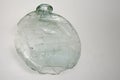 Cracked and partially broken ancient flat body bottle dated by archaeologists to 1st or 2nd century