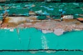 Cracked peeled green blue paint background on old wooden floor, cracked paint pattern Royalty Free Stock Photo