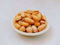 Cracked pistachio nut dry fruit food with shell roasted and salted pistachios in a bowl pista closeup pistacia vera pistache photo Royalty Free Stock Photo