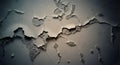 Cracked plaster surface texture in soft greys with faint teal highlight, rough details under dramatic lighting Royalty Free Stock Photo