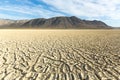 Cracked playa mud texture leading out to the mountains on the Black Rock desert