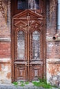 Cracked red and paint on old vintage wooden door Royalty Free Stock Photo