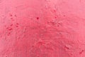 Cracked red paint texture. Close-up of old painted red wall. Abstract grunge background. Vintage scratched surface Royalty Free Stock Photo