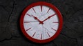 cracked red and white clock face on dark background Royalty Free Stock Photo