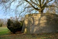 Cracked retaining walls of an old baroque bastion. The terrace has become a place for an old plane tree that grows on top and the Royalty Free Stock Photo