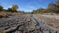 A cracked riverbed the last remnants of a onceflowing stream now dried up and barren