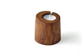 Cracked sawn wood candle holder and pillar candles isolated on a white background Royalty Free Stock Photo