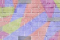 Cracked and scratched wall with graffiti. Abstract detail of urban street art design close-up, pastel colors. Modern stylish