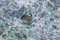 Cracked and shattered glass. Abstract texture and background. Broken glass close-up on the ground Royalty Free Stock Photo