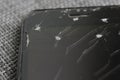 Cracked smartphone screen macro. Repair and damage concept Royalty Free Stock Photo