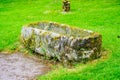 Cracked stone coffin or tomb in churchyard Royalty Free Stock Photo