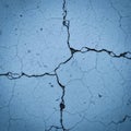 Cracked surface with light blue color, featuring multiple intersecting fissures. The texture Royalty Free Stock Photo