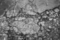 Cracked texture of small gravel stone in a concrete slab cement floor close up