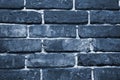 Cracked and textured blue wall, brick wall background. Color of the year 2020 concept. Close up. Fashionable classic blue pantone Royalty Free Stock Photo